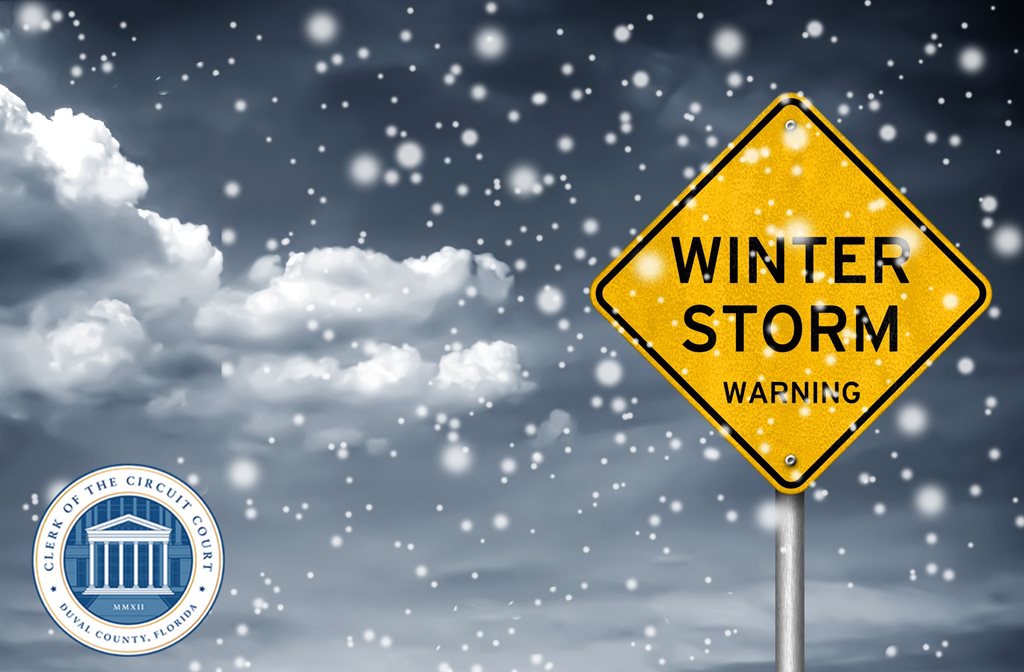 yellow winter storm warning sign with snowy background
